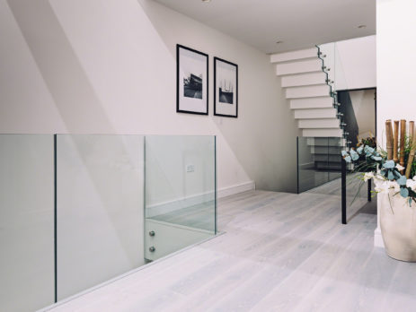 Glass Standoff Buttons on staircase in a modern home