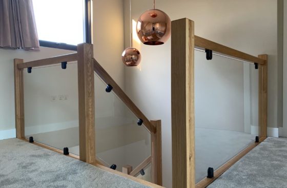 Toughened Glass with Flat Back Glass Clamps on Wooden Staircase