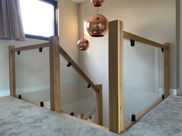 Toughened Glass with Flat Back Glass Clamps on Wooden Staircase