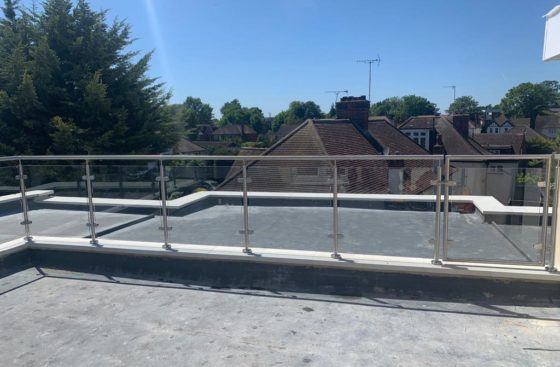 post & rail system on a balcony with a gate